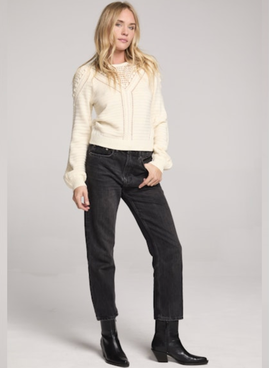 Model styled in Saltwater Luxe Gianny Sweater in cream with black jeans and boots for chic fall outfit