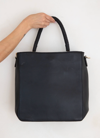 RISA Vancouver Camilla Tote in black upcycled leather with braided handles and gold hardware detail.