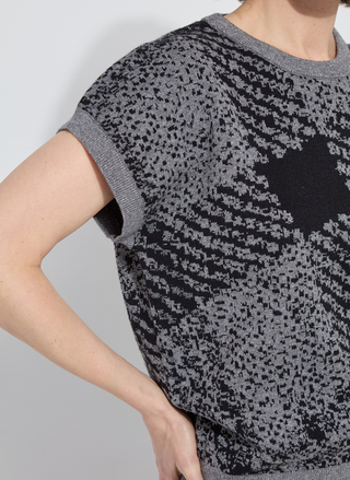 Side detail of Lyssé Germaine Pullover Sweater showing rolled short sleeves and knit texture.