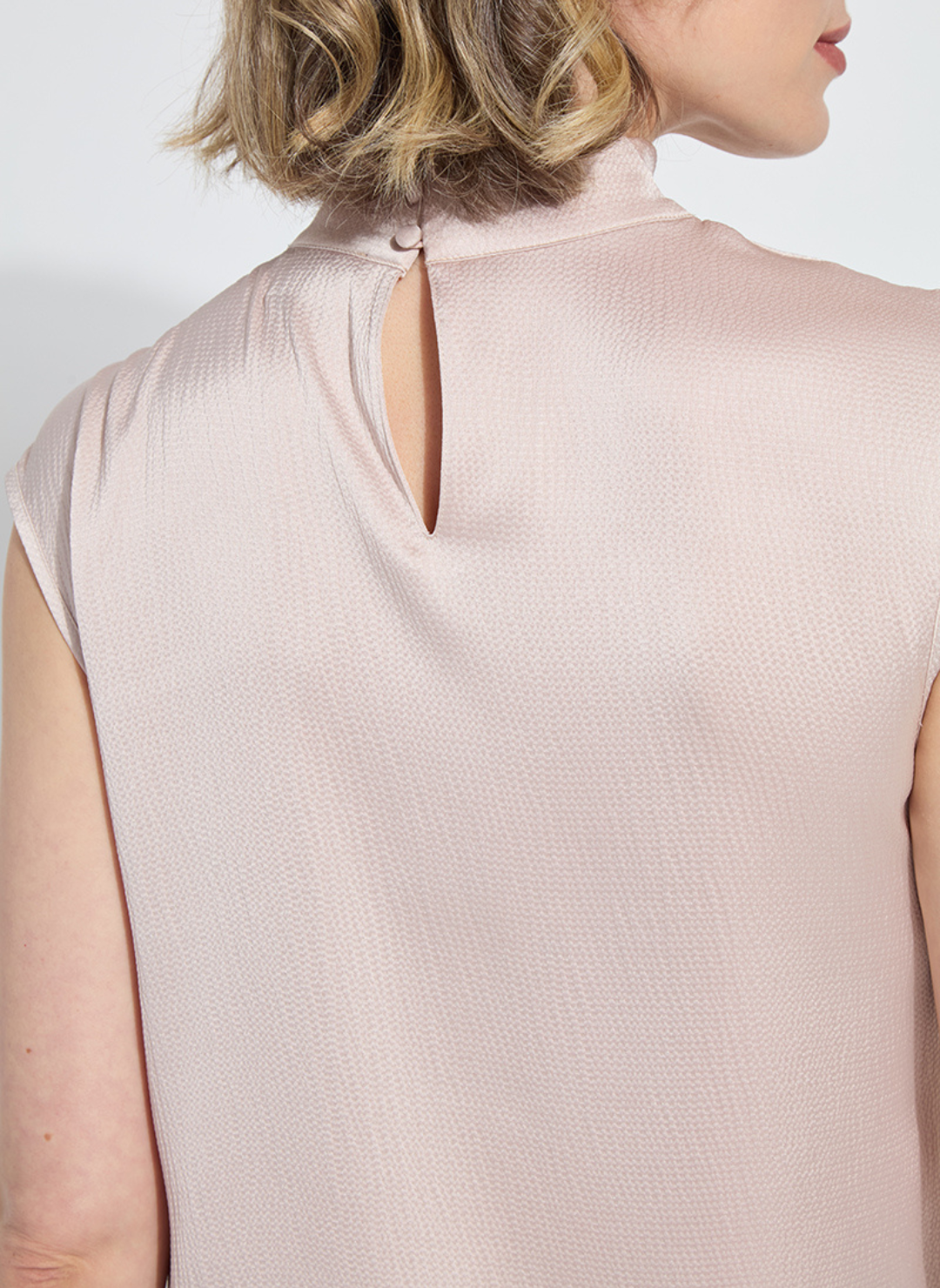 Back button closure in pink.