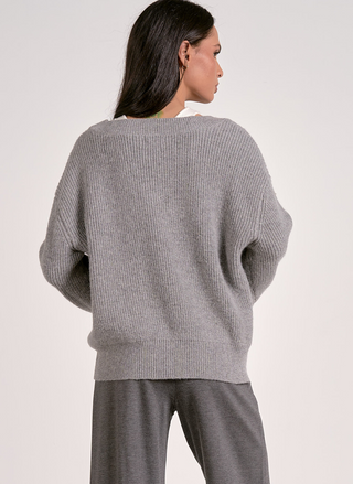 Back view of Elan Café Society Sweater in grey with layered white neckline insert.