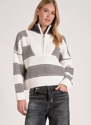 Woman wearing Elan Hearthside Stripe Pullover with bold gray, ivory, and black stripes.