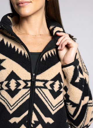 Close up view of Canyon Jacket showcasing the collar & bold Aztec-inspired pattern.