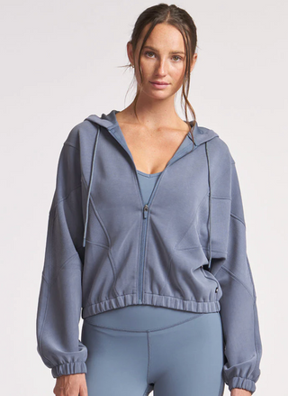Model wearing Thrive Société Ultraluxe Oversized Hoodie in blue-grey front view