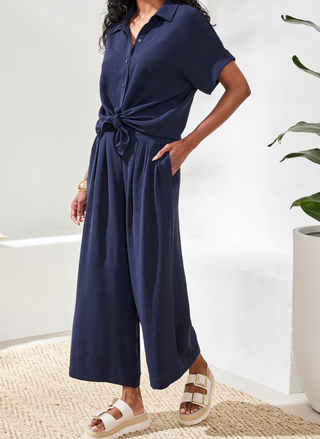 Side view of Tribal cropped pants in navy polyester displaying relaxed, flowing fit and comfortable drape