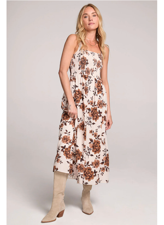 Woman wearing Saltwater Luxe Costa Midi Dress in cream floral print front view.