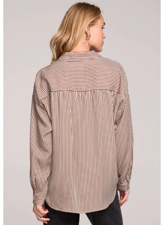 Back view of a woman wearing Saltwater Luxe Isadora striped shirt against a plain background
