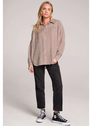 Woman wearing Saltwater Luxe Isadora Shirt in brown and white pinstripes.