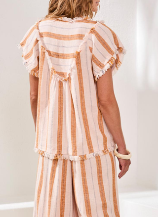 Back view of the Tribal Morocco Striped Woven Tee with  raw edges.