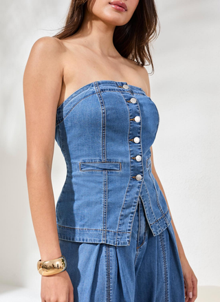 Tribal strapless denim bustier top styled with denim pants