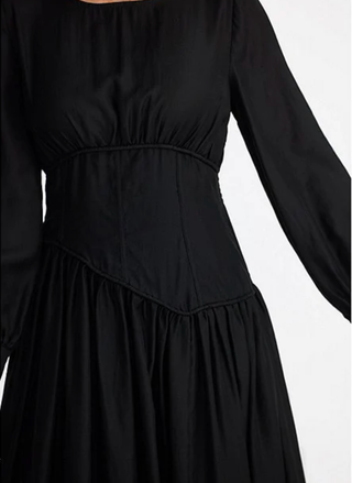 Black dress with long sleeves on a white background