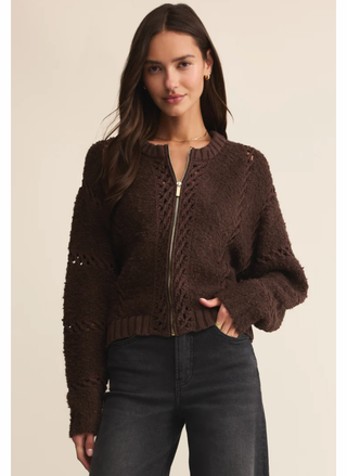 Model wearing Z Supply Sundance Cardigan Jacket in dark brown with zip closure and black denim