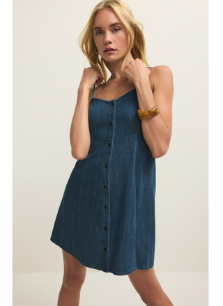 Front view of model wearing Angel Eyes Mini Dress in lightweight denim with button-front detail