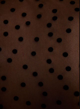 Brown fabric with black polka dots