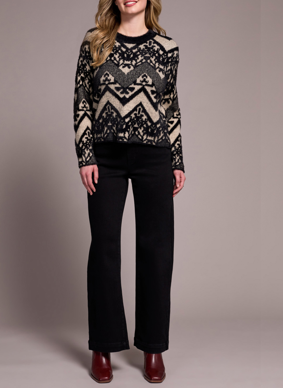 Front view of model wearing Tribal Albuquerque Sweater with black and beige geometric pattern.