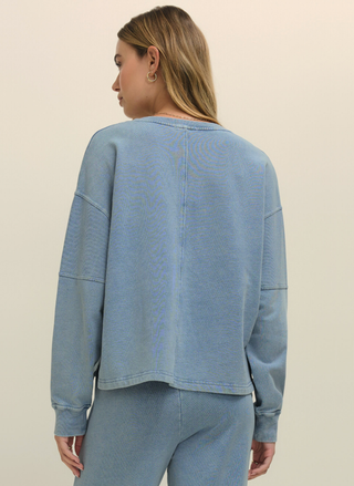 Back view of Z Supply Delphine Sweatshirt showing relaxed fit and ribbed cuff details.