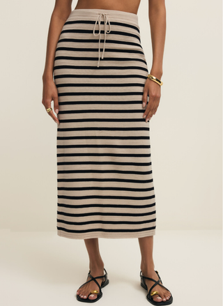 Front view of model wearing Z Supply Emori Striped Skirt in sand and black stripes.
