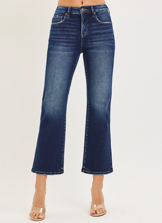 Risen Tummy Control High Rise Crop Bootcut Jeans in dark wash denim with cropped flare hem.