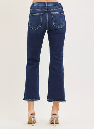 Blue jeans worn by a person on a white background