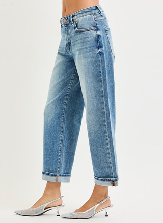 Light blue jeans worn by a person on a white background