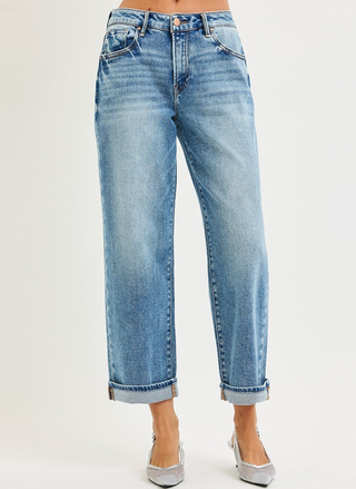 Light blue jeans worn by a person on a white background