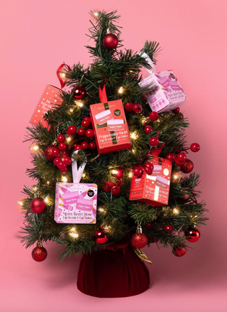 Peppermint Swirl Lip Treatment Duo with Sugar Sugar Scrub and Balm Babe Lip Balm on a Christmas Tree.