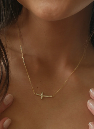 Model wearing Cross Necklace — 18k gold-plated, adjustable faith-inspired jewelry.