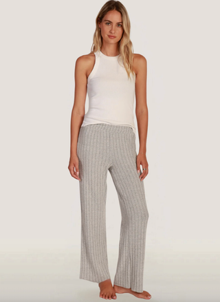 Model wearing Dylan Emma grey ribbed lounge pants with elastic waist, straight-leg fit.