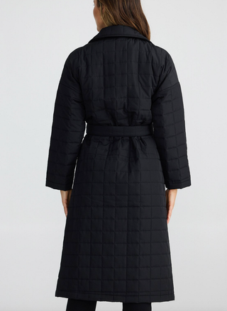 Back view of Brave & True Bedford Longline Puffer in black, showing quilted texture and waist tie