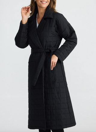 Front view of Bedford Longline Puffer in black with waist tie, worn by model