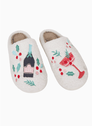 Pair of slippers with festive designs on a white background