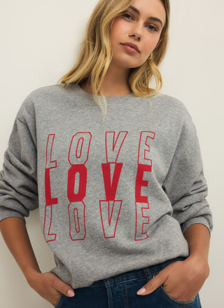Z Supply Amore Relaxed Sweatshirt in heather gray with bold red LOVE graphic and relaxed fit.