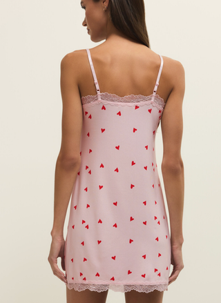 Back view of pink heart print Z Supply chemise with lace trim and spaghetti straps.
