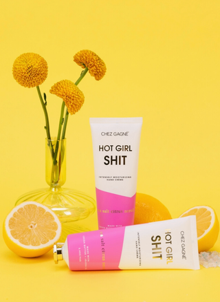 Alt Text: Hot Girl Shit hand crème sea salt citrus neroli vegan moisturizing hand lotion on yellow background
