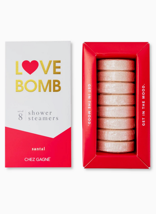 Box of 'Love Bomb' shower steamers with packaging on a white background. Love Bomb shower steamers Valentine’s Day gift set of 8 in red packaging