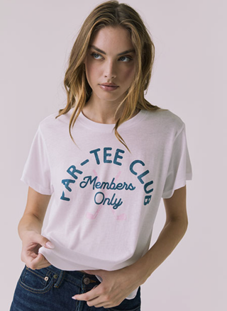 Woman wearing white Chaser Par-Tee Club graphic t-shirt with relaxed fit and playful slogan