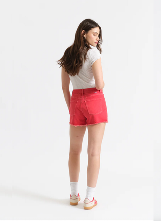 Rear view of the red Trouble Maker jean shorts highlighting the flattering high-rise fit and classic pocket placement.