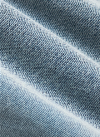 Close-up of textured blue fabric.