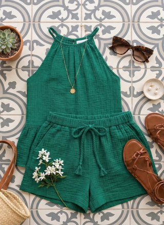 Grace & Mila Wasabi Shorts on a tiled floor with a green tank, sunglasses, shoes, and a plant.