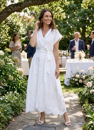 Woman in a Brave & True Versailles 100% Cotton maxi dress standing outdoors with tables and people in the background