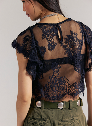 Back view of the black Lunar Ash Lace Top showing the sheer lace detail and back keyhole closure.