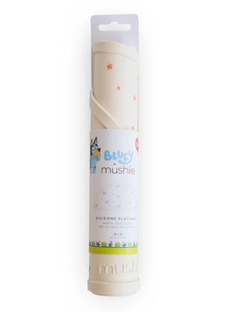 Silicone baking mat in packaging with 'mushie' branding on a white background