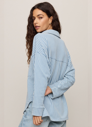 Back view of striped knit jacket, showing tailored seam details.