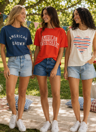 3 friends standing outdoors wearing 4th of July themed graphic tee's.