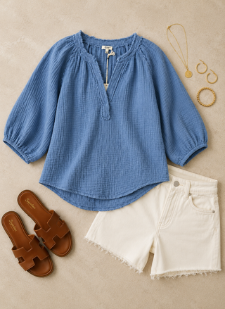 Dylan Jolie top, white Z Supply denim shorts, brown sandals, and jewelry on a beige surface
