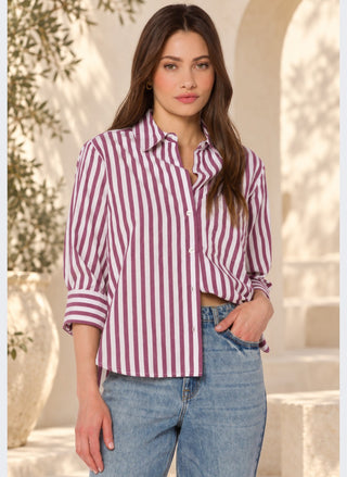 Three-quarter close-up of the Velvet Heart Valencia Button-Up Shirt in burgundy stripe, highlighting the relaxed fit and cuffed sleeve