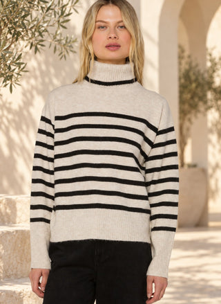 Front view of the Velvet Heart Parley Striped Sweater in oatmeal and black stripe with a mock turtleneck