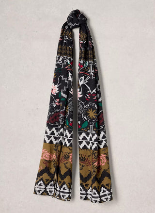 White Stuff Callie multi color printed scarf tied in a knot against a neutral background. 