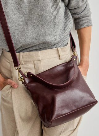 Wine full-grain milled leather crossbody bag with slouchy hobo shape by Latico Leathers