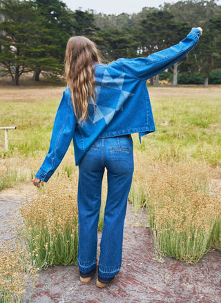 Women's indigo denim shacket with trucker collar and two chest patch pockets by Porter Blue